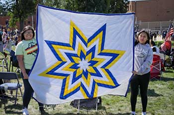 A St. Joseph’s Indian School alum blessed a donor with a star quilt at the 48th Annual Powwow!