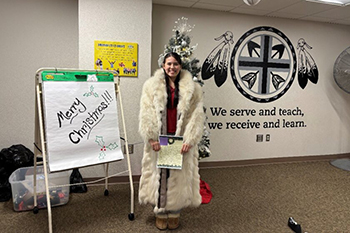 Angelina proudly wears the beautifully restored fox fur coat donated by a generous benefactor.